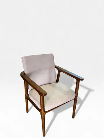 Nordic solid wood chair with armrests and a light-colored, textured fabric cushion