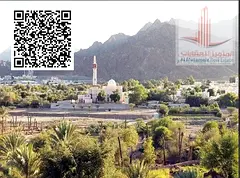 Two adjacent residential plots for sale in Manama 1, each plot measuring 4101 sq ft, with a permit f