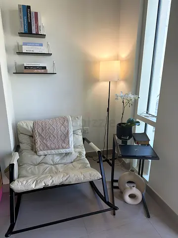 Cozy Chair and Desk Combo for a Stylish Home Office lamp and shelves