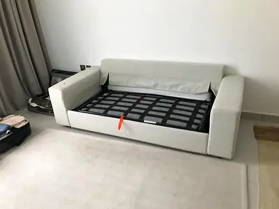 Beige sofa bed with mattress