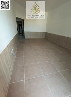 A well-maintained apartment for annual rent in Al Rawda 2, featuring a large layout and practical de