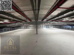 Large warehouse on the main street, with a large open space in front, suitable for all activities.
