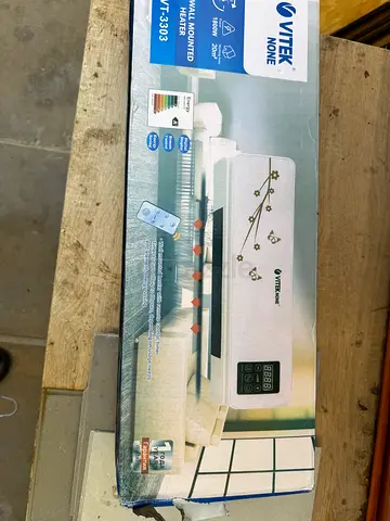 Portable wall mounted heater with fan