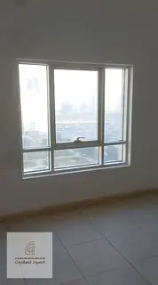 Two bedrooms and a living room with parking and a garden view, located in Al Nahdi Tower.