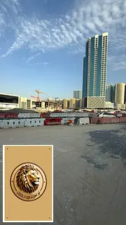 Two plots of land for sale on a main street, corner of Ajman Port Street, overlooking Ajman Creek.