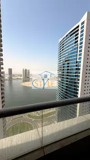 An apartment in Al Khan featuring a direct view of Al Khan Lake and another view of Al Qasba Canal.