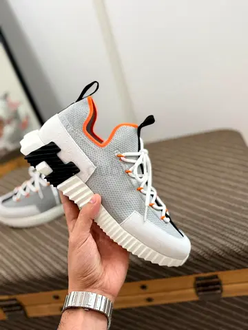 Hermes Lift on Trendy Sneakers for a Casual Look