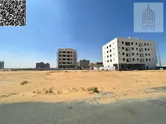 Residential/commercial land for sale in Ajman, Al Alia Global City area. Land area: 4305 sq ft. Buil