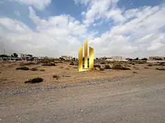 Residential land for sale in Sharjah, Al Raqiba 6, opposite the mosque, Al Suyoh suburb. Ownership b