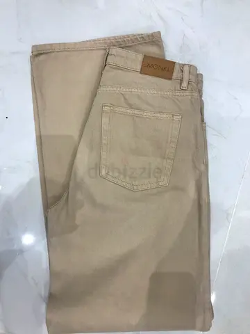 Beige wide-leg jeans (or trousers) from Monki. Monki is a Swedish womens fashion retailer owned by