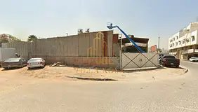 Industrial land in a prime corner location on two streets - includes a fence and warehouse - ideal l