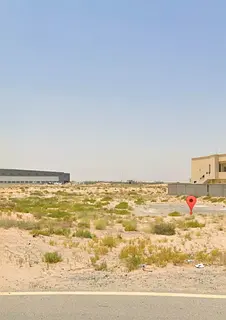 Prime industrial land for sale on Street 36 in Al Sajaa Industrial Area. Compensation included.
