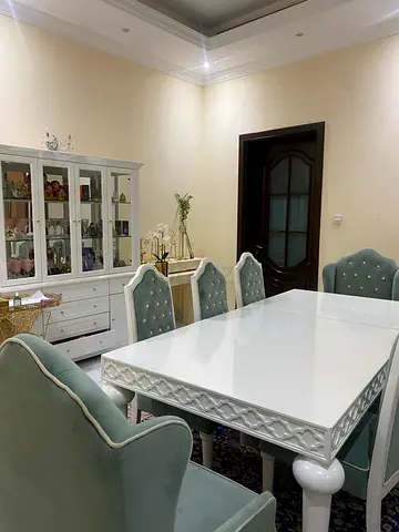 Elegant White Dining Table Set with Plush Chairs