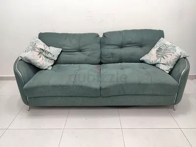 Comfortable Green Sofa with Cushions