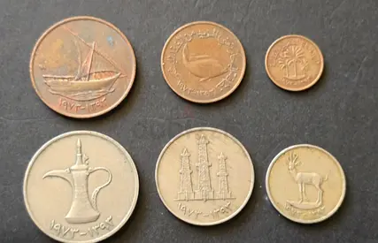 Collection of Vintage Coins Featuring Traditional Designs