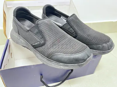 Skechers Men’s Slip-On Sneakers in Black