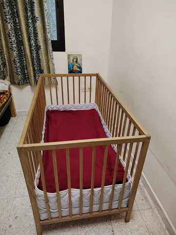 Baby cot with rail