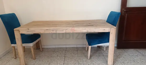 Rustic Wooden Dining Table with Blue Chairs