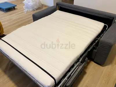 Gunnared dark two seater sofa bed with mattress