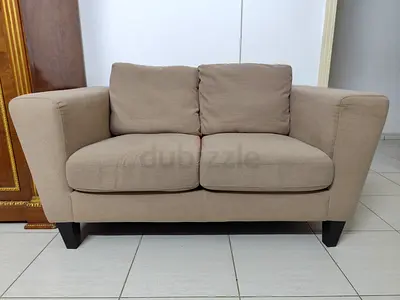 Comfortable Beige Two-Seater Sofa