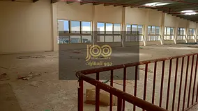 A fully integrated complex consisting of warehouses and shops, located on a main street.