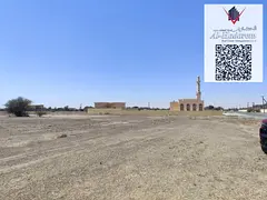 Residential land for sale in Ajman - Al Manama 9, On the asphalt road.