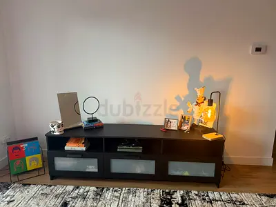 Stylish Black Entertainment Center with Unique Decor
