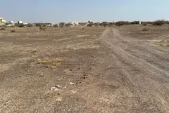 Land for sale in Al Sahma, corner plot on Street 36