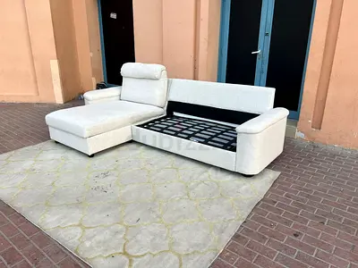 Beige L-Shaped sofa bed with mattress