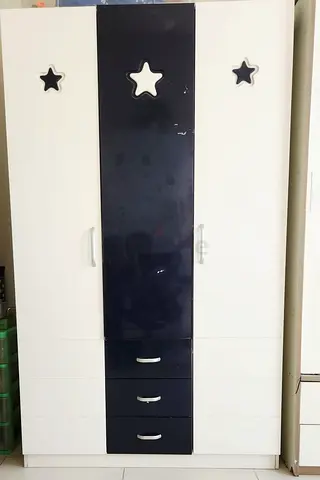 White and Navy Blue Wardrobe with Star Accents