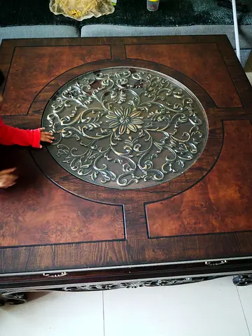 Elegant Wooden Coffee Table with Intricate Metal Inlay