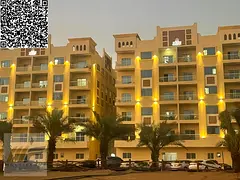 Own a two-bedroom apartment with a living room in Princess Village, Al Yasmin, Ajman, with installme