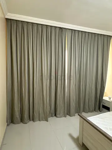 Black our curtain floor to ceiling