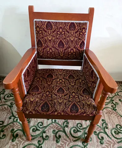 Elegant Vintage Armchair with Intricate Upholstery