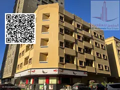 Two-bedroom apartment with a living room, two bathrooms, and a balcony in Al Bustan area