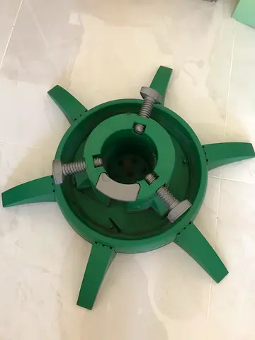 Christmas tree stands. These stands are typically made of durable plastic or metal, feature a wide b