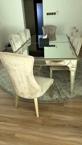 Elegant Glass Dining Table with Plush Chairs