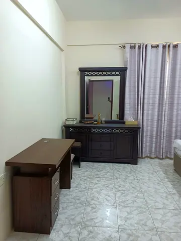 Elegant Wooden Dresser with Mirror and Stool