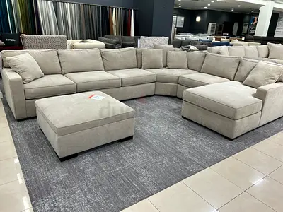 Spacious Beige L-Shaped Sofa with Ottoman