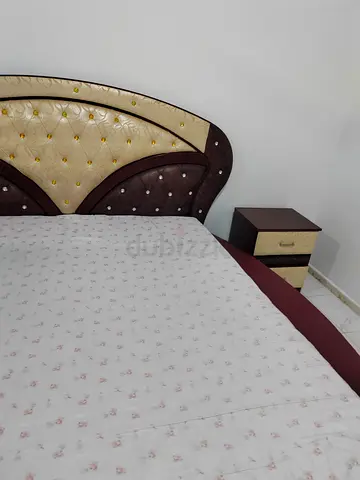 Elegant King-Size Bed with two side tables and big mirror dressing table. Neat and clean condition