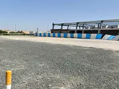 Land for sale in Industrial Area 18, measuring 12,920 square feet, prime location on the main street