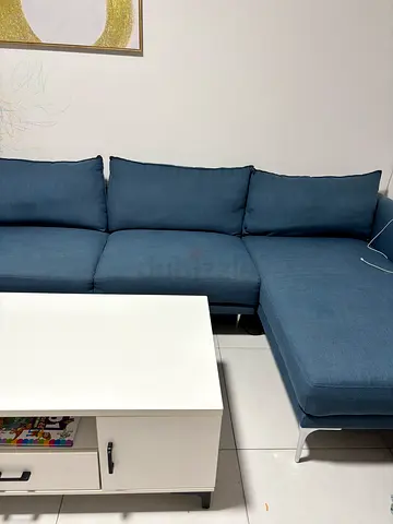 Comfortable Blue Sofa with Coffee Table