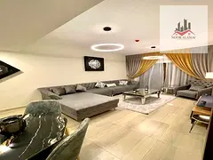 Sharjah, Al Taawun area: Two-bedroom apartment with a living room, kitchen, two bathrooms, and a bal