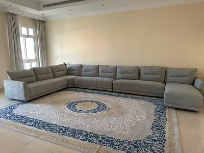 Modern Grey L-Shaped Sofa with Elegant Rug