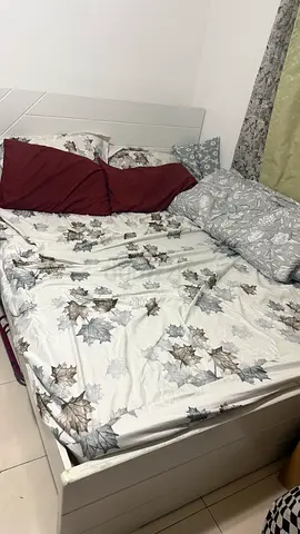 Comfortable Bed with Floral Bedding