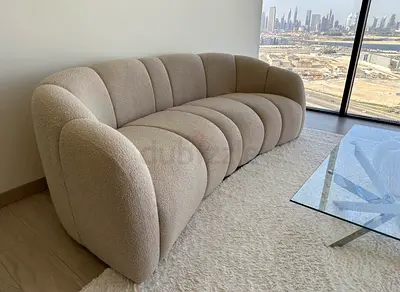 Stylish Curved Beige Sofa for Modern Living Room