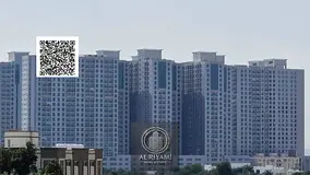 Two-bedroom apartment with a living room and balcony for rent in Al Rashidiya 2, near Falcon Towers