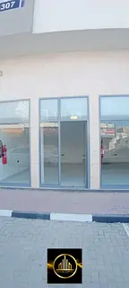 Shops for annual rent, first occupancy building in Al Karama area, Ajman