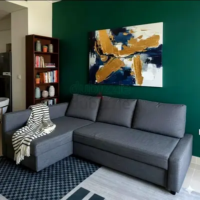 Stylish Grey L-Shaped Sofa with Modern Art Decor