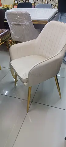 Elegant Cream Upholstered Chair with Gold Legs